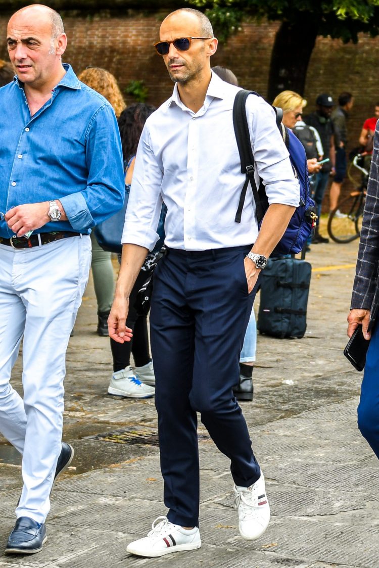 The white dress shirt is well balanced with white sneakers!