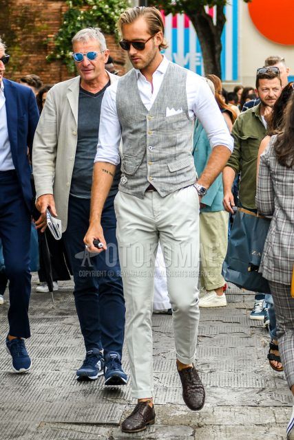 Spring, summer and fall men's coordinate outfit with plain brown sunglasses, plain gray gilet, plain white shirt, plain brown leather belt, plain white cotton pants and brown other leather shoes.