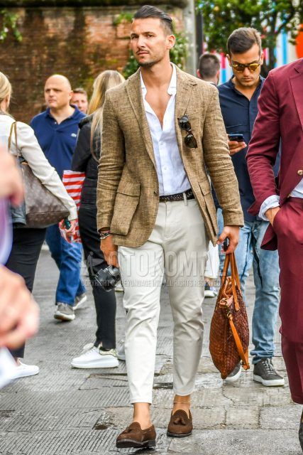 Spring, summer and fall men's coordinate outfit with plain brown tailored jacket, plain white shirt, plain brown mesh belt, plain beige cotton pants, brown tassel loafer leather shoes and brown other tote bag.