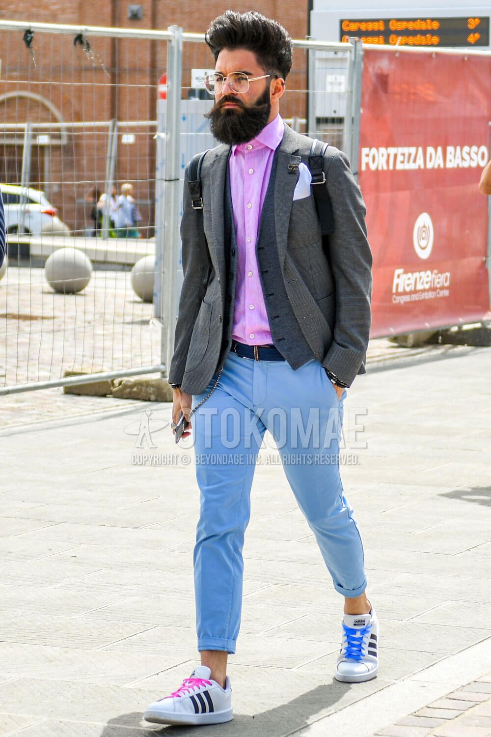 Dries Van Noten Paris Menswear S S Male model wearing paterned blue suit  jacket over striped pink shirt and trousers; unsmiling Stock Photo - Alamy