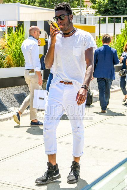 A summer men's coordinate outfit with plain sunglasses, plain white t-shirt, plain beige leather belt, plain white denim/jeans, and black high-cut sneakers.