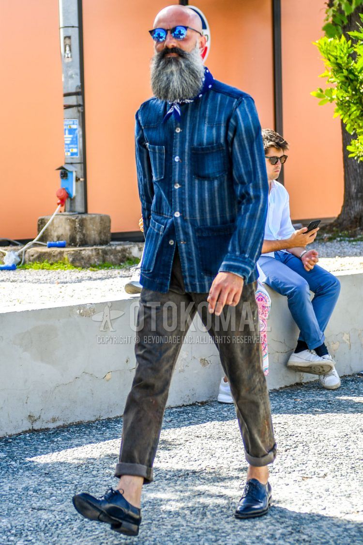 Men's spring/summer/fall outfit with plain sunglasses, blue other bandana/neckerchief, blue striped shirt jacket, blue striped denim jacket, plain brown cotton pants, and black plain toe leather shoes.