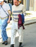Spring and fall men's coordinate outfit with beige border sweater, plain navy t-shirt, plain white cotton pants, and black other boots.
