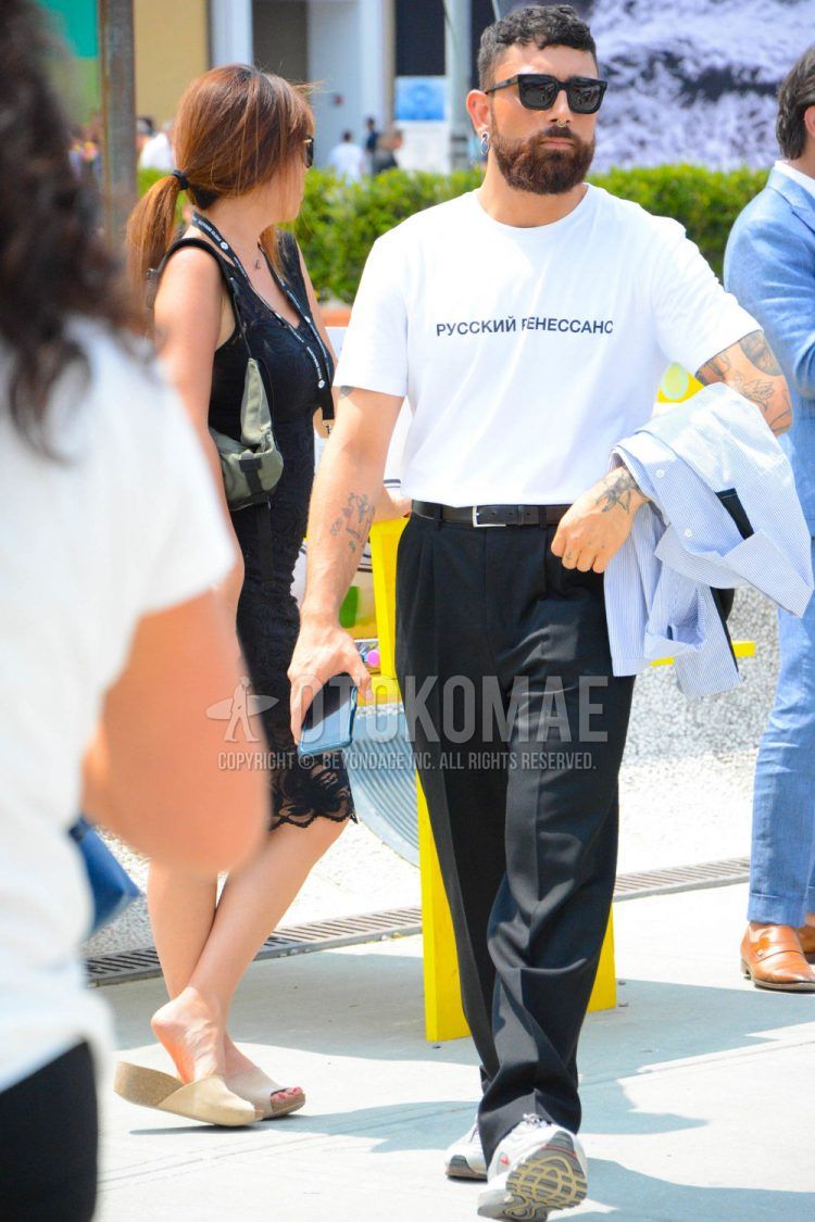 A spring/summer men's coordinate outfit with plain sunglasses, white other t-shirt, plain leather belt, plain navy slacks, and white low-cut Nike sneakers.