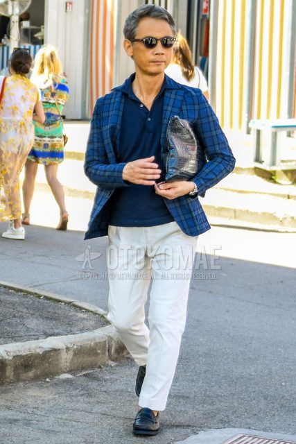 Spring, fall and summer men's coordinate outfit with plain sunglasses, navy check tailored jacket, plain navy polo shirt, plain white chinos and black coin loafer leather shoes.
