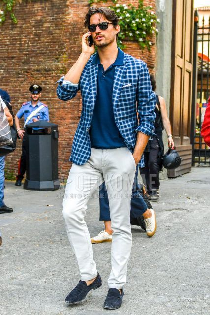 Men's spring and summer coordinate outfit with plain sunglasses, blue checked tailored jacket, plain navy polo shirt, plain beige chinos, and suede navy coin loafer leather shoes.