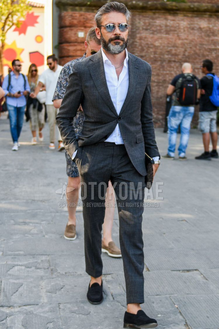 Spring, summer and fall men's coordinate outfit with round plain silver sunglasses, plain white shirt, suede black coin loafer leather shoes and gray checked suit.