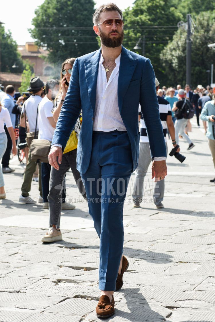 Spring, summer and fall men's coordinate outfit with plain gold sunglasses, plain white shirt, brown tassel loafer leather shoes and plain blue suit.
