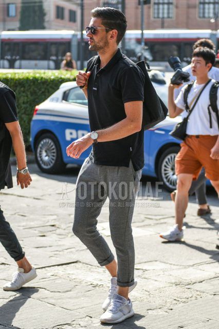 Summer men's coordinate outfit with plain silver sunglasses, plain black polo shirt, plain gray others, and white low-cut sneakers.