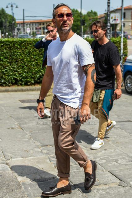 A summer men's coordinate outfit with plain brown sunglasses, plain white t-shirt, plain brown cotton pants, and brown tassel loafer leather shoes.