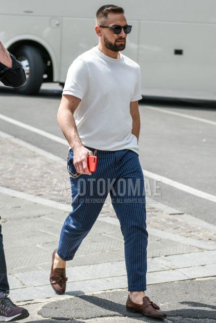 Summer men's coordinate outfit with clear/gray plain sunglasses, knit plain white t-shirt, navy striped slacks, and brown tassel loafer leather shoes.