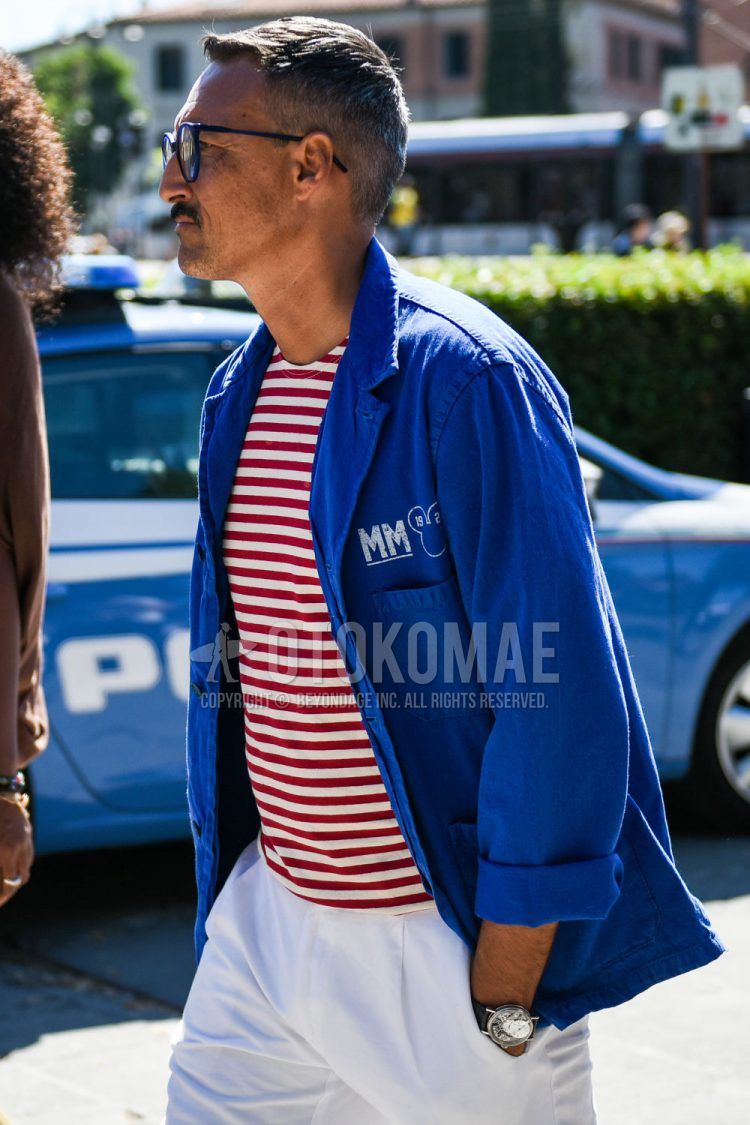 Spring and fall men's coordinate outfit with plain navy glasses, tailored jacket with one blue point, red and white striped t-shirt, plain white cotton pants, and plain pleated pants.