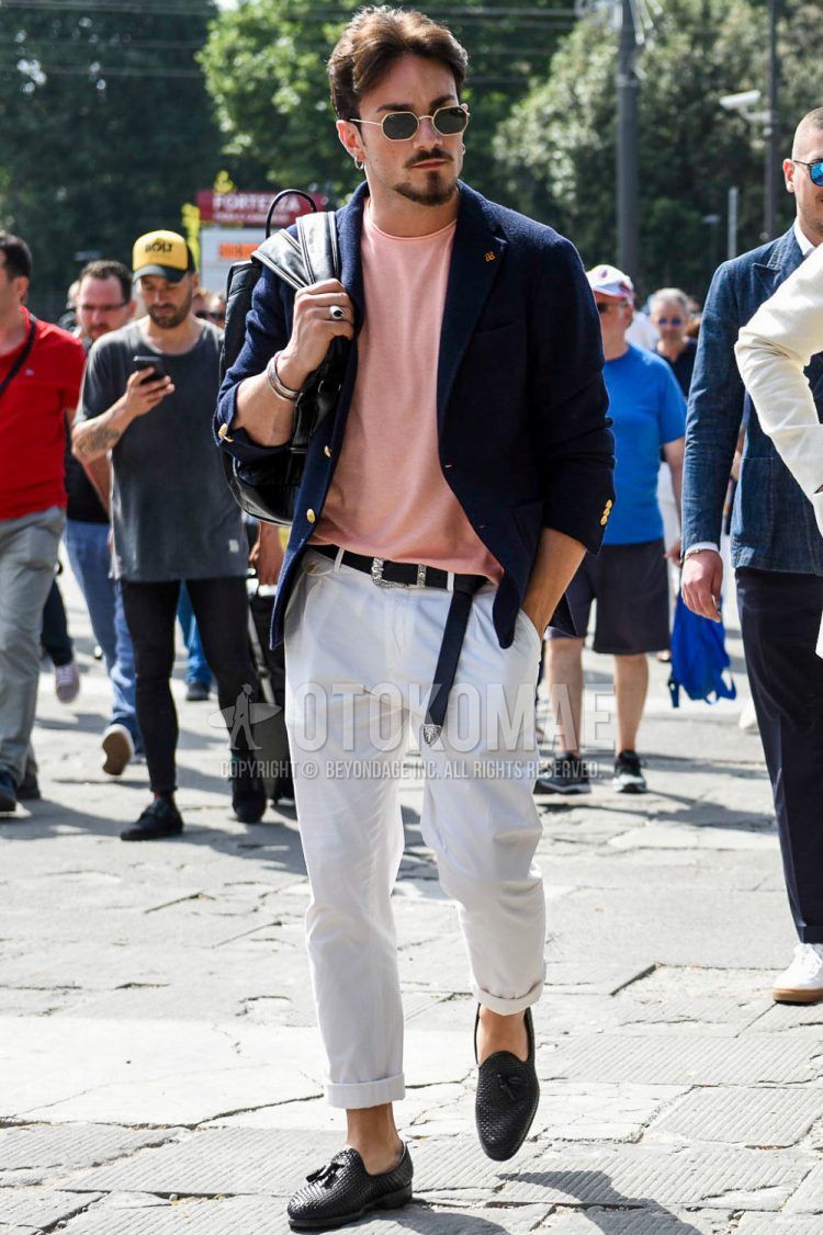 Spring, summer, and fall men's coordinate outfit with gold and black plain sunglasses, plain navy tailored jacket by Tagliatore, plain pink t-shirt, plain navy leather belt, plain white cotton pants, and black tassel loafer leather shoes.
