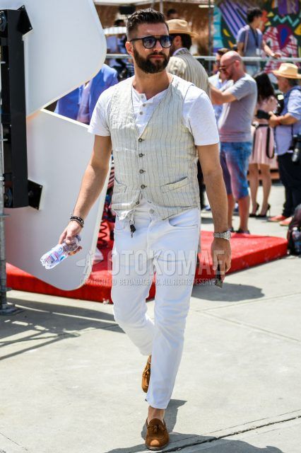 Summer men's coordinate outfit with plain black sunglasses, white striped gilet, plain white t-shirt with henley neck, plain white denim/jeans, brown tassel loafers leather shoes, brown suede shoes leather shoes.
