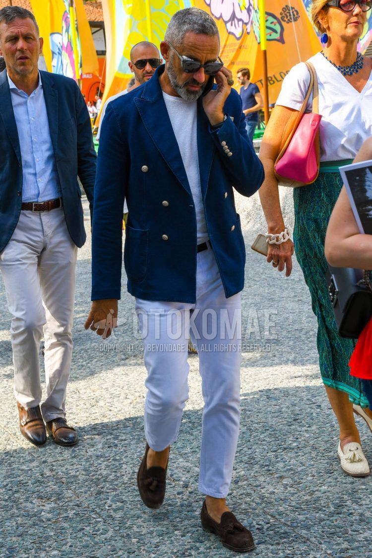 Men's spring/summer/fall outfit with plain sunglasses, plain navy tailored jacket, plain white t-shirt, plain white denim/jeans, brown tassel loafers leather shoes, suede shoes leather shoes.