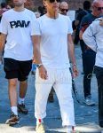 A summer men's coordinate outfit with plain black sunglasses, plain white t-shirt, plain white cotton pants, plain white socks, and Nike beige low-cut sneakers.