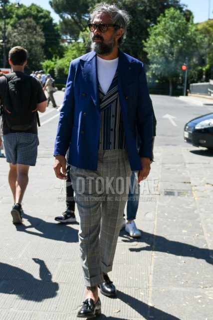Spring, summer and fall men's coordinate outfit with plain black Wellington sunglasses, plain navy tailored jacket, gray striped gilet, plain white t-shirt, gray checked slacks and black tassel loafer leather shoes.