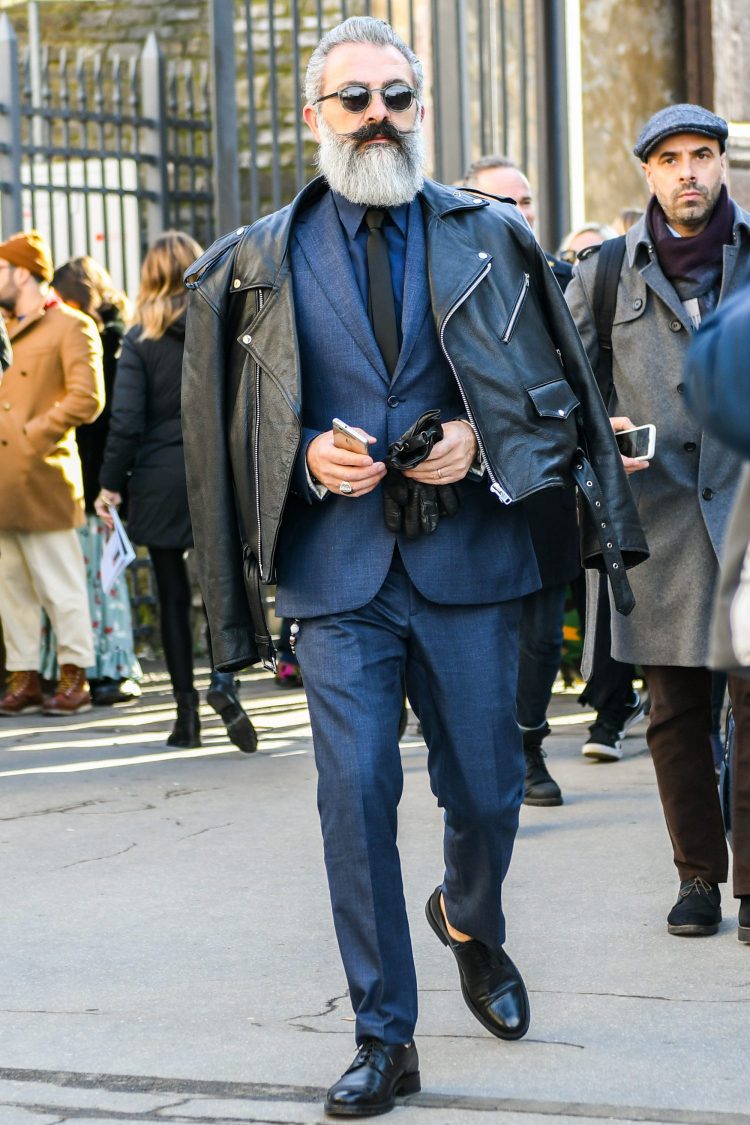 Black tie pulls the navy suit together for a modern look