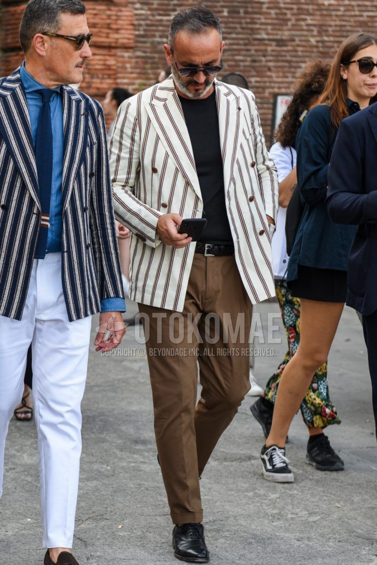 Men's fall/summer/spring outfit with plain black sunglasses, white striped tailored jacket, plain black t-shirt, plain black mesh belt, plain brown slacks, and black straight tip leather shoes.