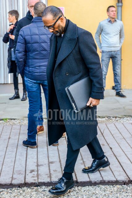 Fall/winter oversized men's coordinate outfit with plain glasses, plain gray chester coat, plain gray slacks, plain black socks, and black plain toe leather shoes.