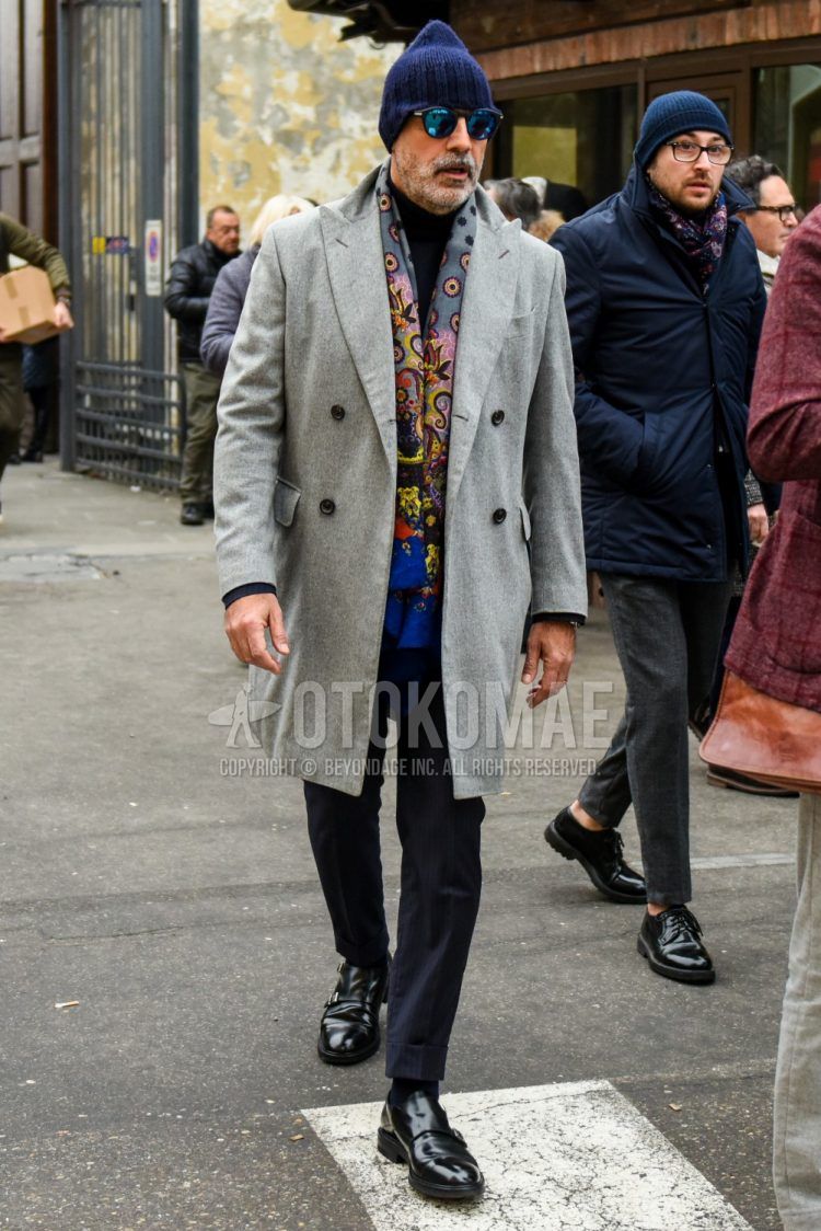 Winter men's outfit with plain navy knit cap, plain sunglasses, gray other scarf, plain gray chester coat, plain black turtleneck knit, gray striped slacks, plain black socks, and black monk shoe leather shoes.