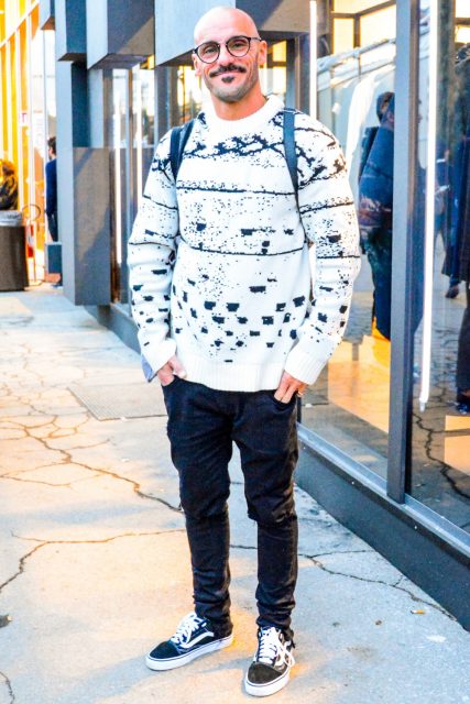 Wearing a men's oversized fall coordinate outfit with plain glasses, white other sweater, plain black denim/jeans, and black low-cut sneakers from Vans.