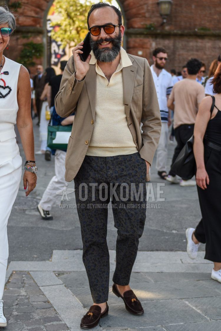 Spring and summer men's coordinate outfit with plain black sunglasses, plain beige tailored jacket, plain beige polo shirt, gray leopard slacks, and suede brown tassel loafer leather shoes.