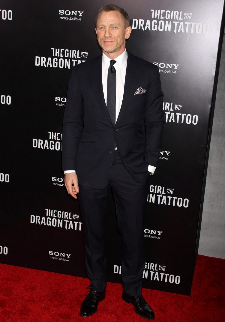 Daniel Craig black suit style abbreviated formal wear dark suit code example