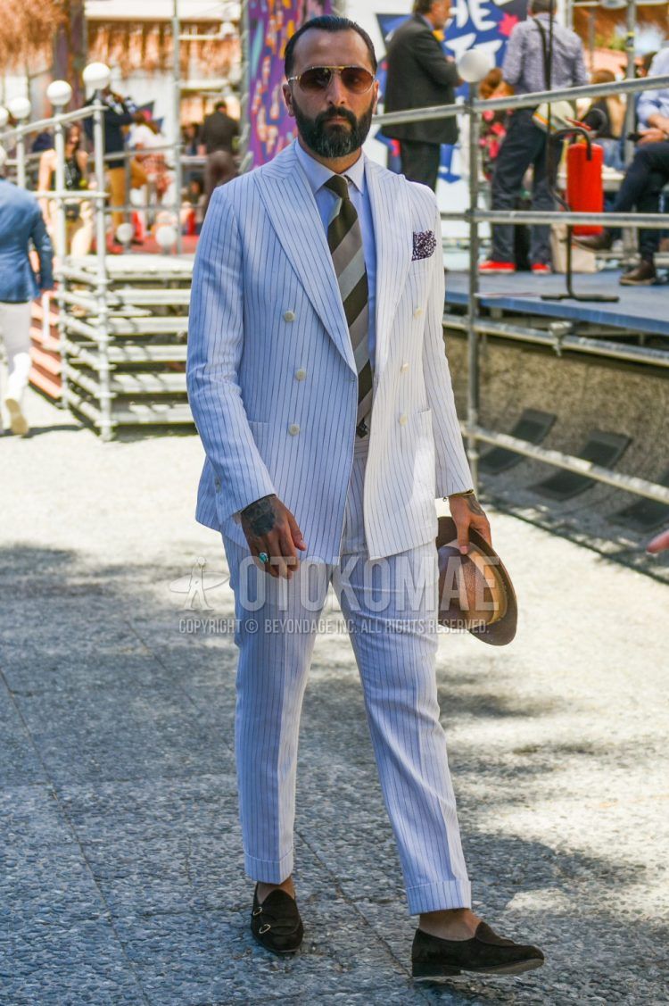 Summer-spring-fall men's coordinate outfit with plain brown hat, plain gold sunglasses, plain white shirt, brown monk shoes leather shoes, white striped suit and brown striped tie.
