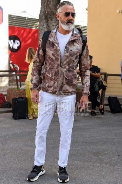 Men's coordinate and outfit with teardrop plain silver sunglasses, plain white T-shirt, brown camouflage hoodie, plain white cotton pants, and black low-cut sneakers.