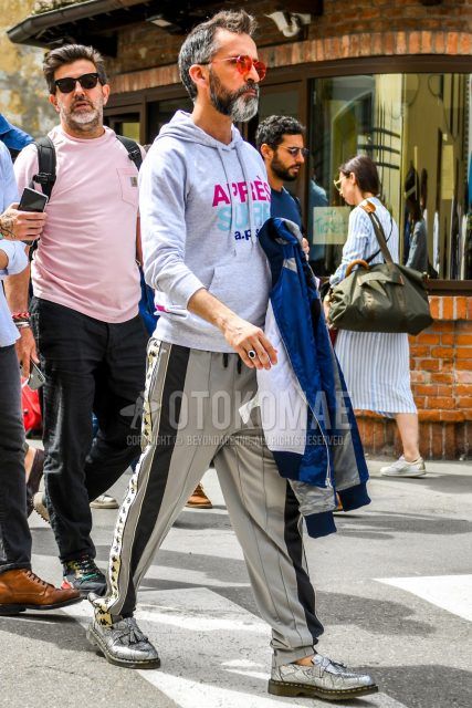 Men's coordinate and outfit with plain sunglasses, Kappa gray graphic hoodie, plain gray sidelined pants, and python gray tassel loafer leather shoes.