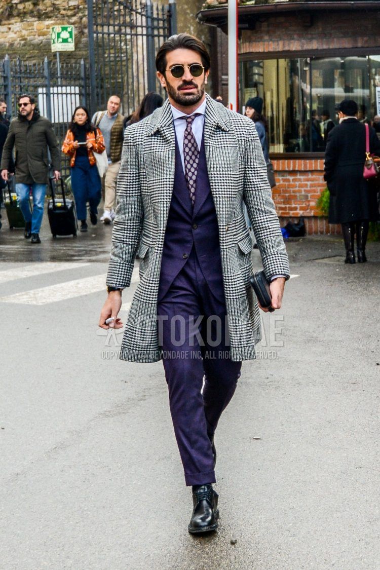 Men's fall/winter outfit with plain sunglasses, glen check gray check stainless steel coat, plain white shirt, black chukka boots, plain purple suit, and purple dot tie.