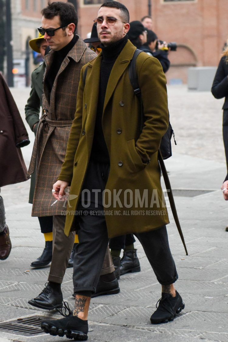 Winter men's coordinate outfit with solid color sunglasses, olive green solid color chester coat, black solid color turtleneck knit, wool dark gray solid color others, and Nike black low-cut sneakers.