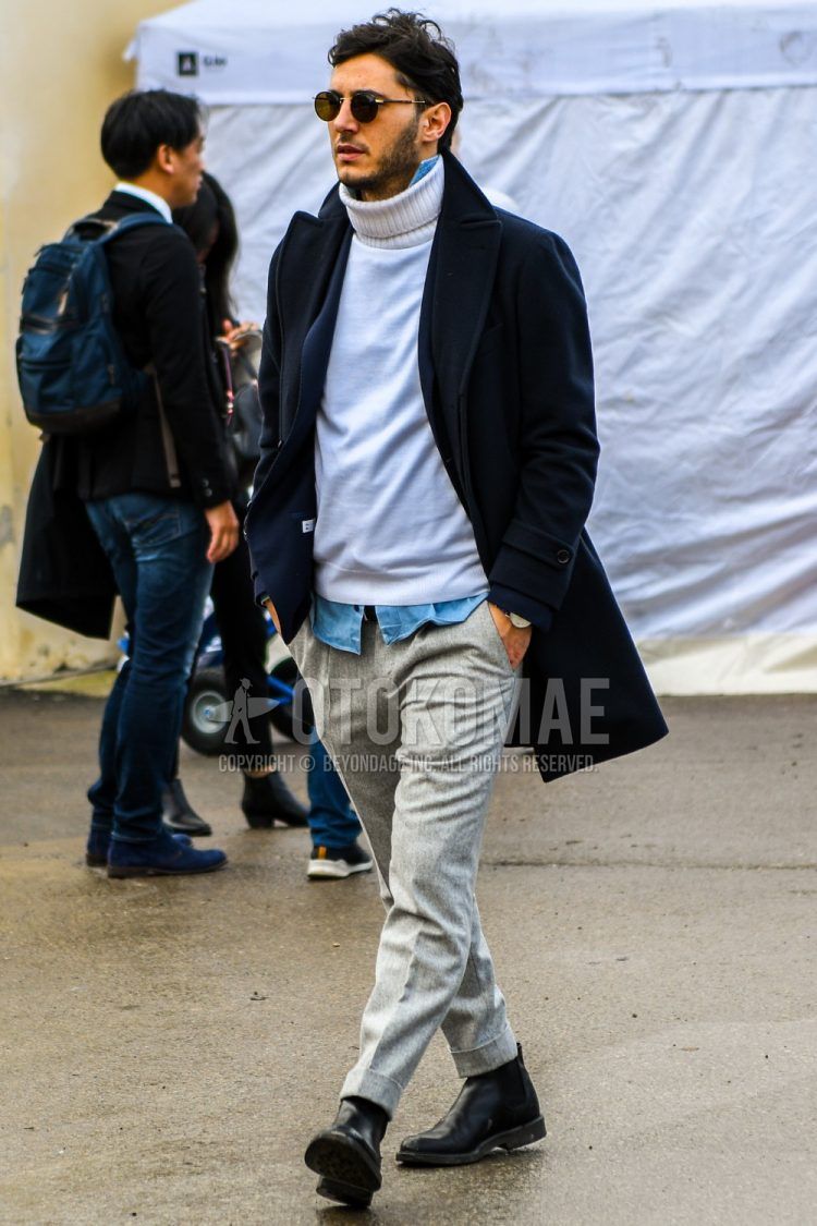 Men's coordinate and outfit with plain sunglasses, plain navy Ulster coat, plain white turtleneck knit, plain light blue denim/chambray shirt, plain wool gray slacks, and black side gore boots.