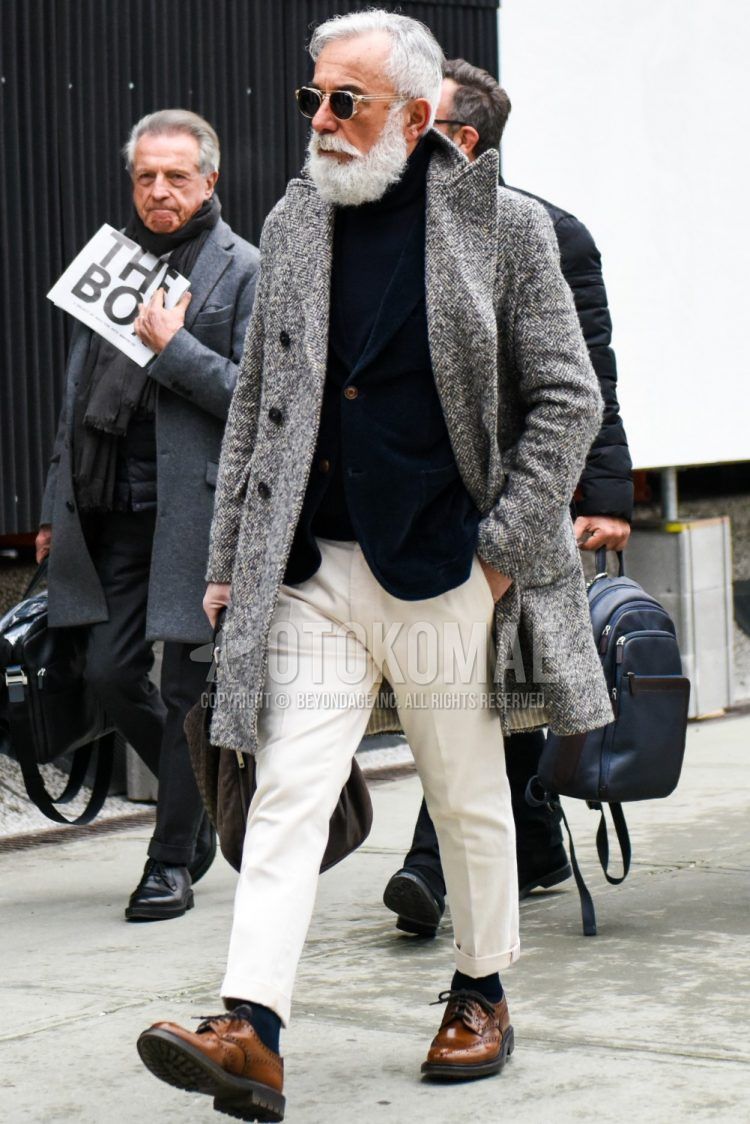 A winter men's outfit with plain sunglasses, plain gray chester coat, plain navy tailored jacket, plain black turtleneck knit, plain white cotton pants, plain black socks, and brown brogue shoes leather shoes.