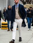 Plain white glasses, plain navy chester coat, plain beige gilet, plain blue shirt, glen check gray checked tailored jacket, plain black leather belt, plain white cotton pants, plain black socks, brown side gore boots, brown/beige small print Men's fall/winter coordinate outfit with tie.