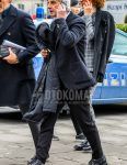 Winter/autumn men's coordinate outfit with a dark gray solid tailored jacket, solid black slacks, and black country boots.