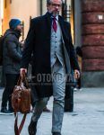 Winter men's coordinate outfit with plain glasses, plain black chester coat, plain white shirt, brown other boots, plain brown briefcase/handbag, plain gray three-piece suit, and red dot tie.