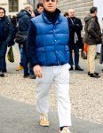 Solid color sunglasses, solid color blue down jacket with down vest, solid color navy shirt jacket with down vest, solid color navy turtleneck knit, solid color white cotton pants, solid color navy socks, Nike Tom Sachs Mardyers beige and white low cut sneakers. Men's coordinate and outfit.