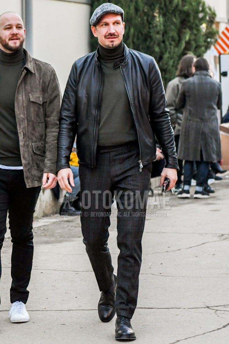 Other solid gray, solid black rider's jacket, dark gray solid turtleneck knit, dark gray check slacks, and black plain toe leather shoes for a winter men's outfit.