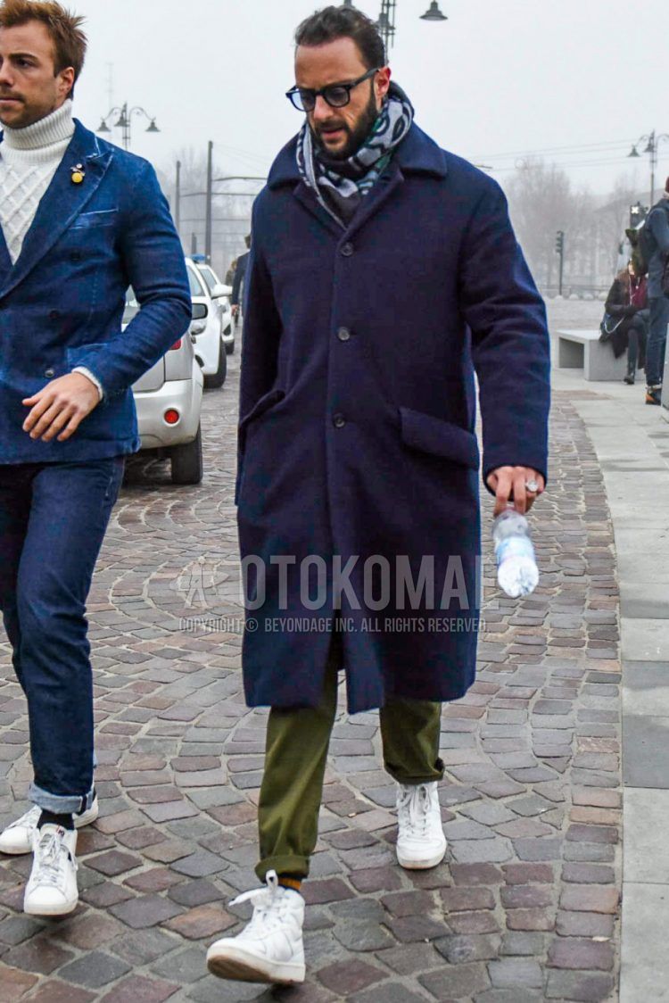 Winter men's coordinate outfit with solid color sunglasses, gray other scarf/stall, solid color navy stainless steel coat, olive green other, white high cut sneakers.