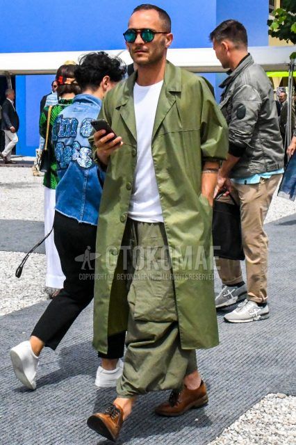 Men's coordinate and outfit with plain sunglasses, plain olive green stainless steel collar coat, plain white t-shirt, plain olive green wide pants, and brown plain toe leather shoes.