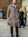 Men's fall/winter outfit with brown/beige checked stainless steel coat, plain white shirt, plain brown slacks, plain black socks, black plain toe leather shoes, and brown dot tie.
