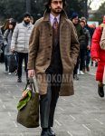 Winter men's outfit with plain glasses, brown checked stainless steel coat, solid pink shirt, solid black socks, white coin loafer leather shoes, solid olive green tote bag, solid dark gray suit, and multi-colored other tie.