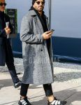 Winter men's coordinate outfit with plain black knit cap, plain sunglasses, gray checked stainless steel coat, plain black hoodie, plain black ankle pants, and black low-cut sneakers.