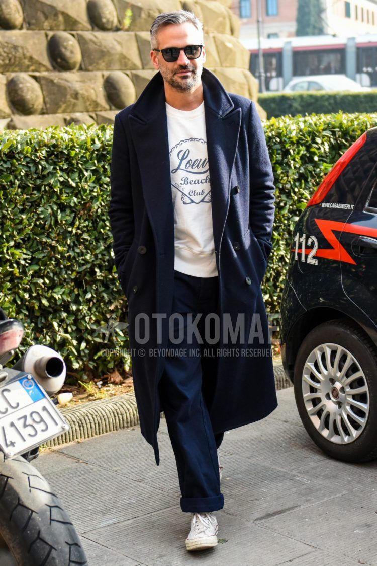 Winter men's coordinate outfit with plain sunglasses, plain navy chester coat, plain white t-shirt, plain navy wide pants, and white high-cut Converse sneakers.