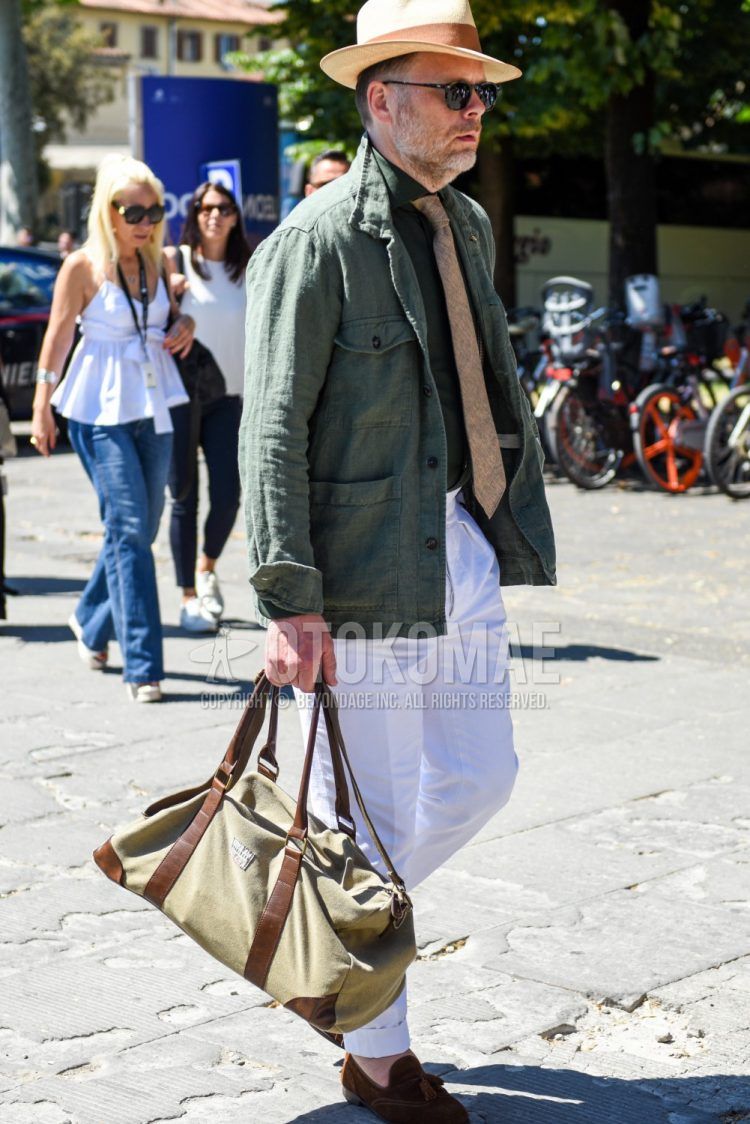 Beige solid hat, black solid sunglasses, linen olive green solid safari jacket, linen green solid shirt, white solid beltless pants, brown tassel loafer leather shoes, beige solid Boston bag, beige other tie for spring, summer and fall Men's Corded Outfits.