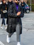 A winter men's outfit for men with a solid purple knit cap, solid sunglasses, dark gray herringbone stainless steel coat, solid purple turtleneck knit, solid gray slacks, solid white socks, and white low-cut sneakers.