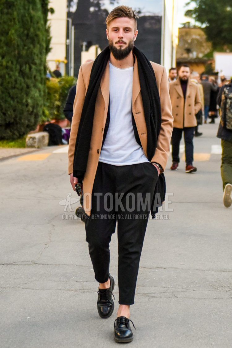 Fall/winter men's outfit with plain black scarf/stall, plain beige chester coat, plain white t-shirt, plain black slacks, plain black cropped pants, plain black pleated pants, and black plain toe leather shoes.