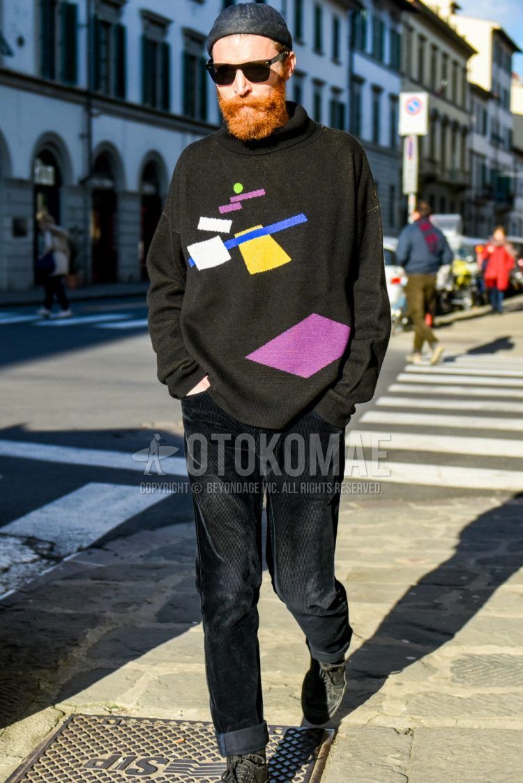 Men's coordinate and outfit with solid black knit cap, solid black sunglasses, solid black turtleneck knit, solid black winter pants (corduroy,velour), and black boots.